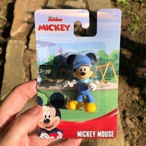 Mickey Mouse holding a wrench toy